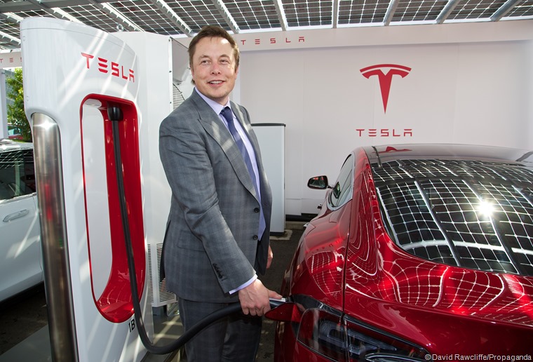 LONDON, ENGLAND - Saturday, June 7, 2014: CEO & Chief Product Architect Elon Musk plugs in a Supercharger to a right-hand drive Model S at the UK launch of Tesla Motors' Model S electric car at the Crystal. (Pic by David Rawcliffe/Propaganda)