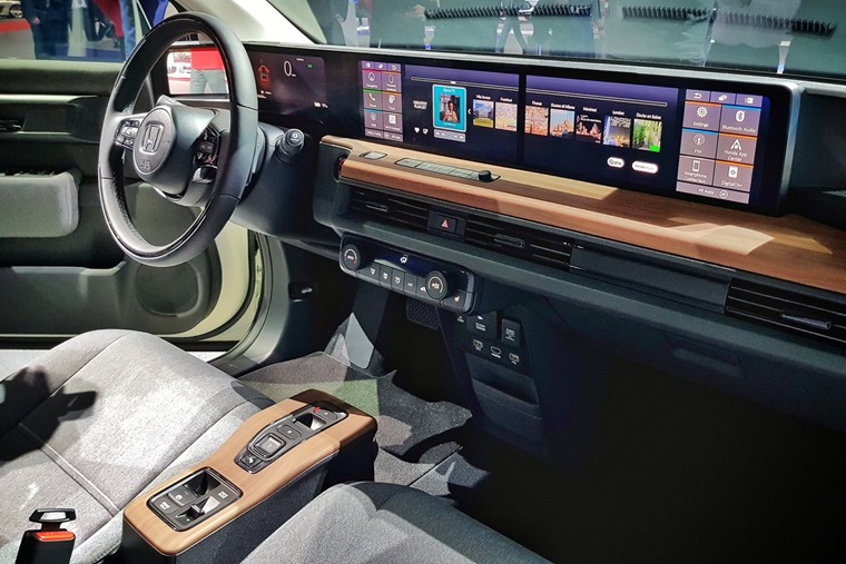 This is achieved via sofa-style fabric, wood-effect dashboard finishing and...